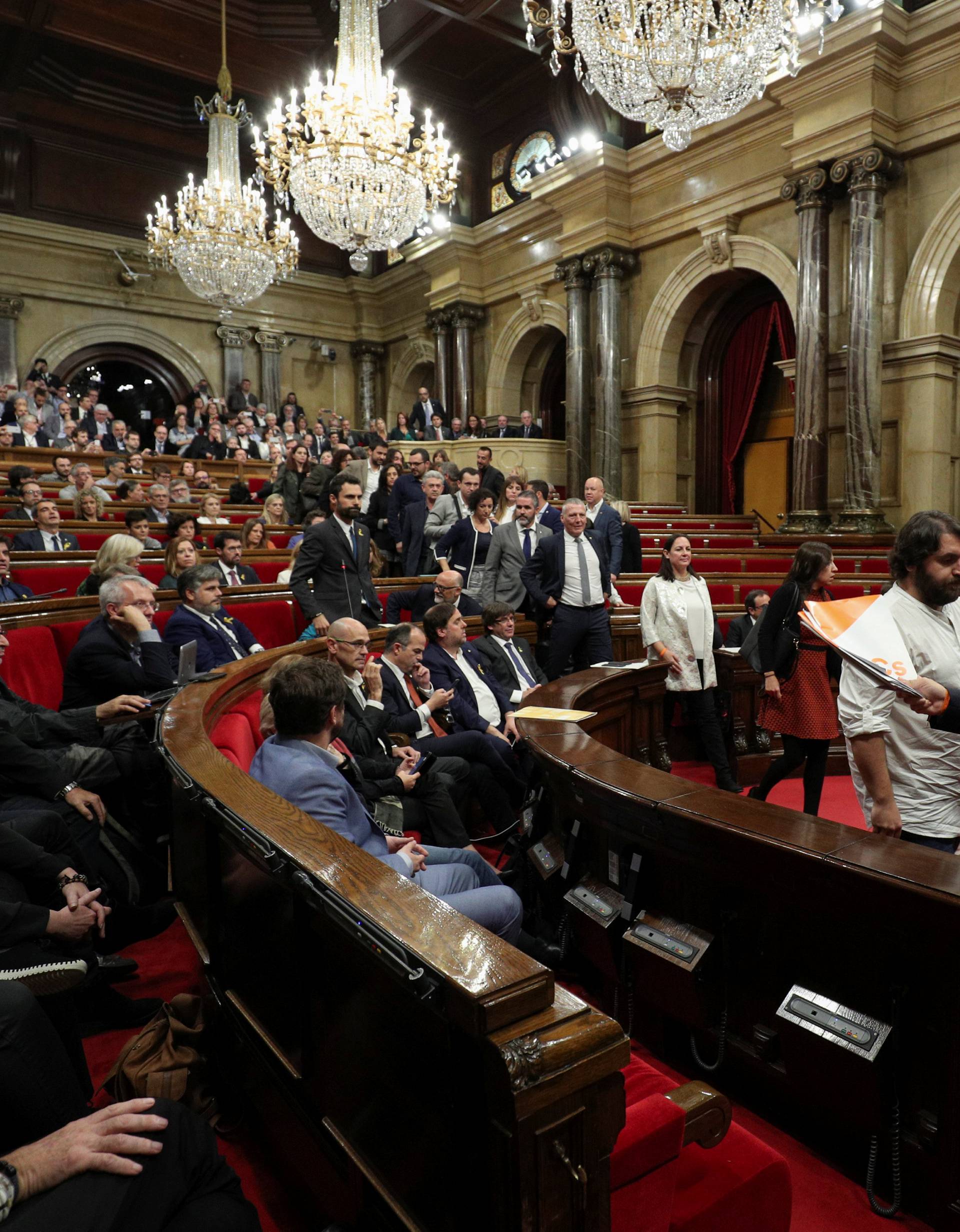 Deputies from PSC, PP, and Ciudiadanos abandon the chamber during a plenary session at the Catalan regional Parliament in Barcelona