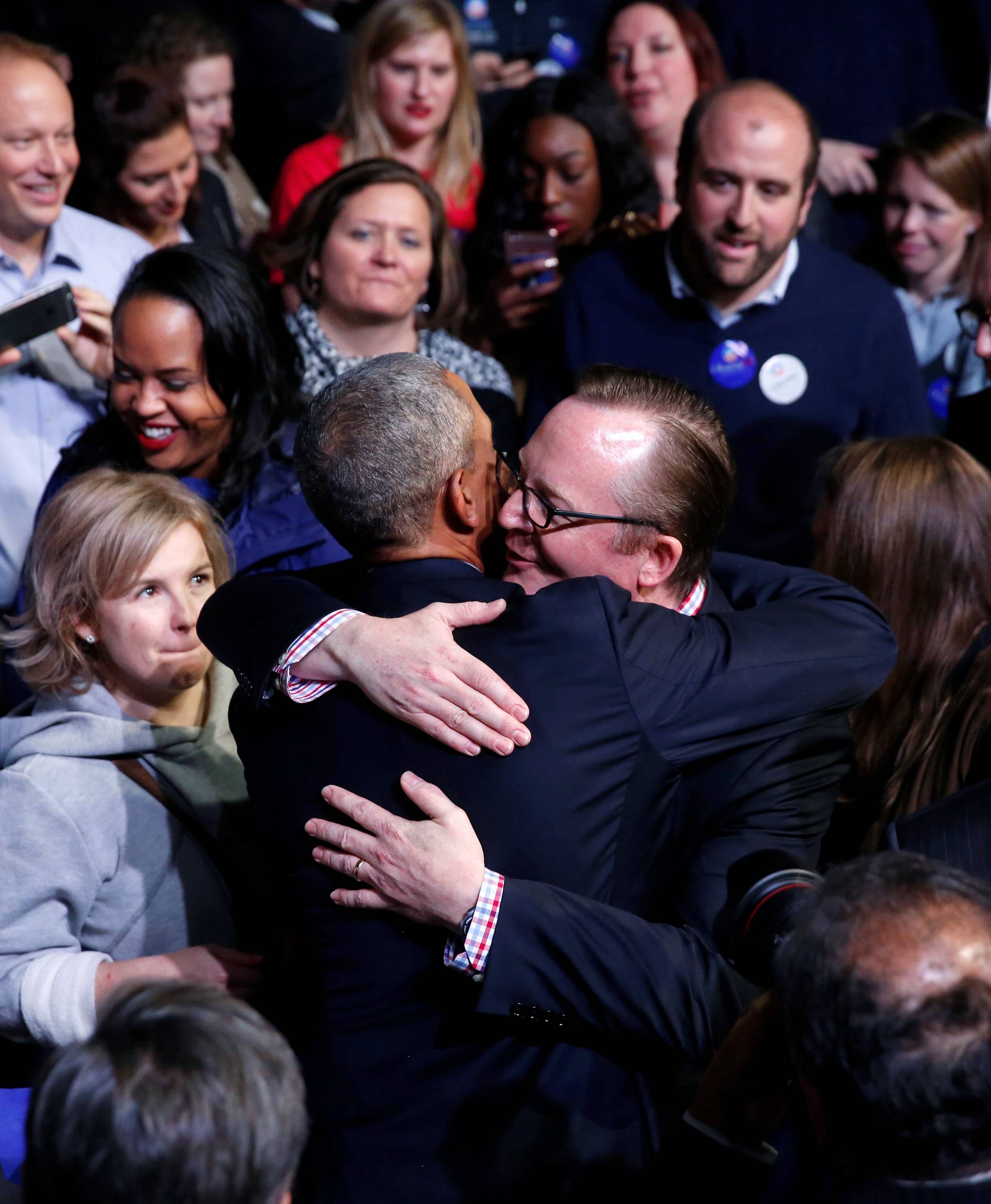 Obama greets Gibbs and other people in the audience after his farewell address in Chicago