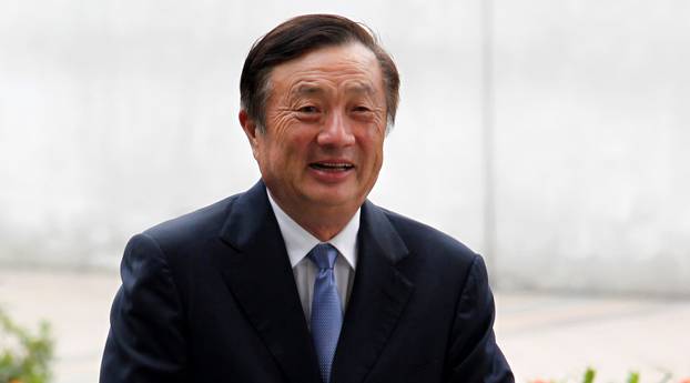 FILE PHOTO: Huawei CEO and founder Ren Zhengfei walks inside Huawei