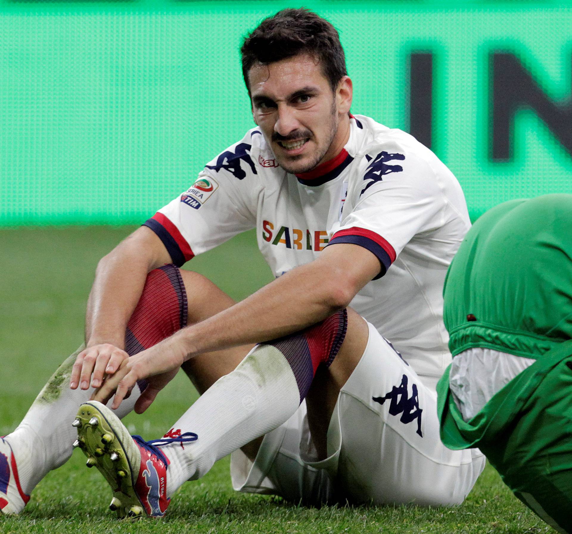 FILE PHOTO: Cagliari's Astori reacts after scoring an own goal against Inter Milan during their Italian Serie A soccer match in Milan