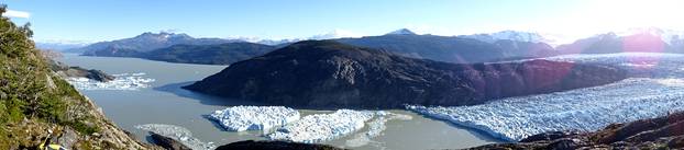 Two new icebergs are seen after breaking off from the Grey glacier in Patagonia