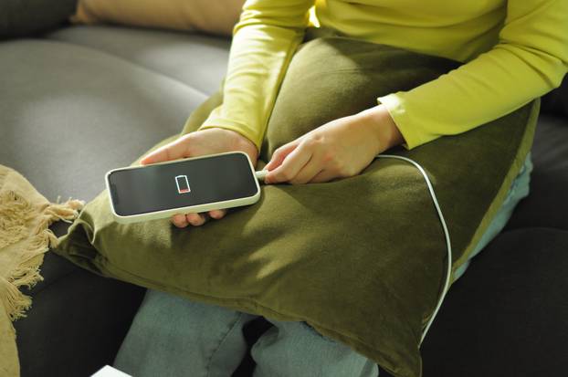 Woman,Hands,Charging,Mobile,Phone,Battery,With,Low,Battery.,Plugging