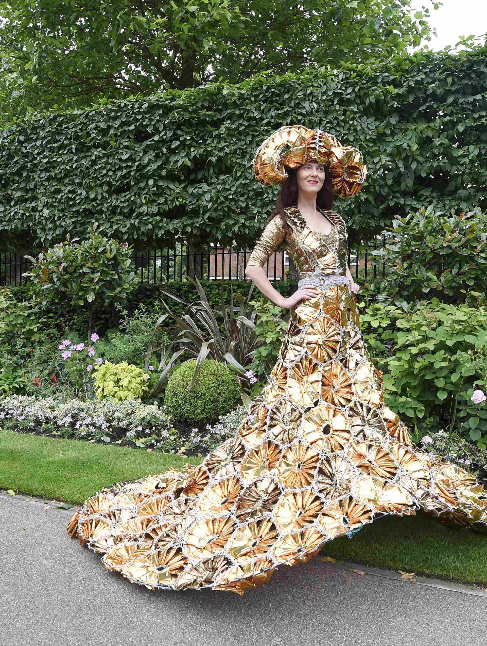 Britain Horse Racing Ladies Day Racegoer wears hat