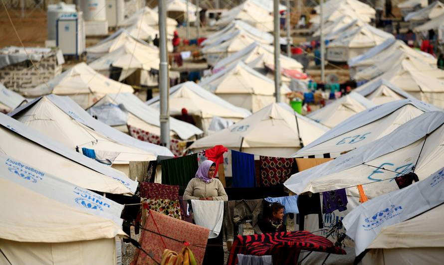 Displaced Iraqi people, who fled the Islamic State stronghold of Mosul are seen at Debaga camp for the displaced on the outskirts of Erbil