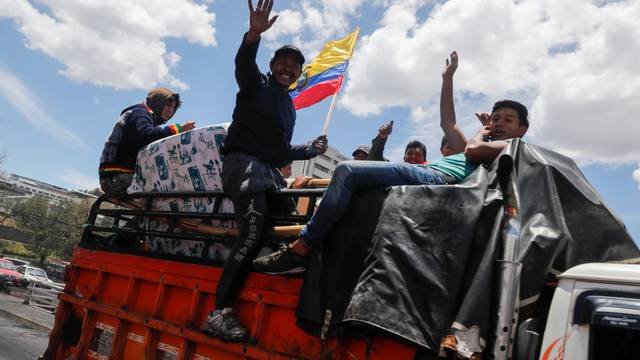 Indigenous people embrace in the aftermath of the last days' protests in Quito