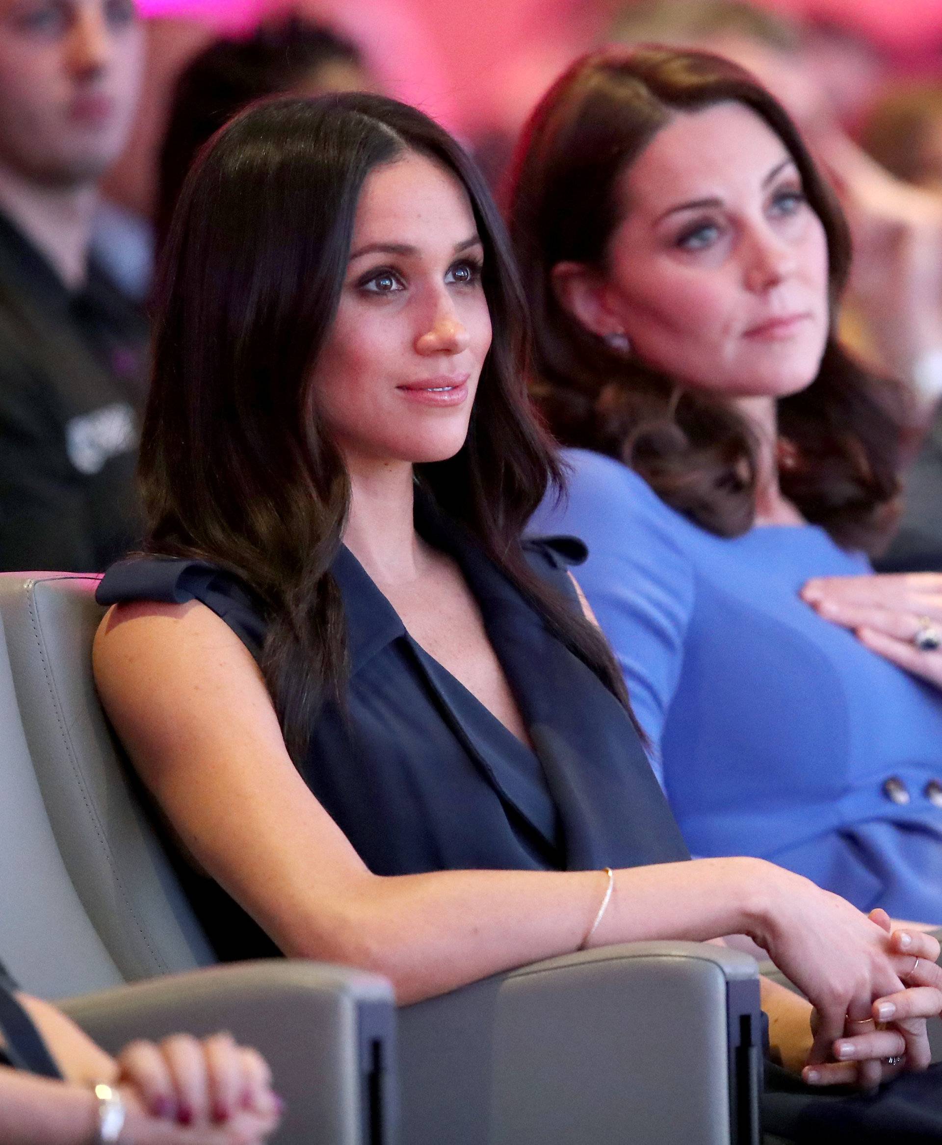 Britain's Prince William, Catherine the Duchess of Cambridge and Prince Harry's fiancee Meghan Markle attend the first annual Royal Foundation Forum held at Aviva in London