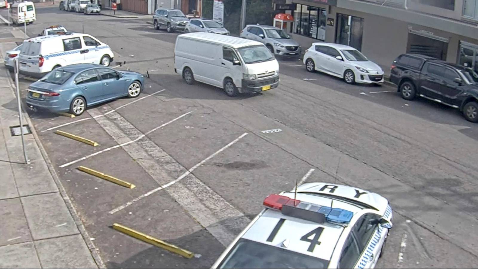 A still image from a CCTV footage shows a van laden with methamphetamines speeding off after hitting an empty police patrol car parked outside a police station in Eastwood