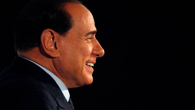 FILE PHOTO: Italian centre-right leader Berlusconi leads a news conference after he won the Italian general elections in Rome