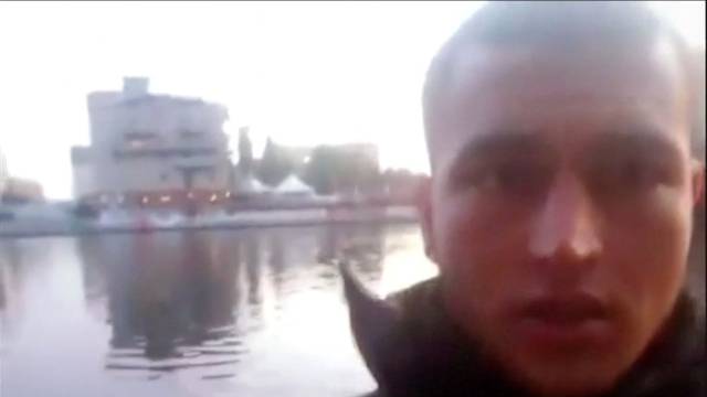 An image grab from a short 'selfie' video clip from a social media website purportedly shows Anis Amri, the Tunisian suspect of the Berlin Christmas market attack, at an unknown location