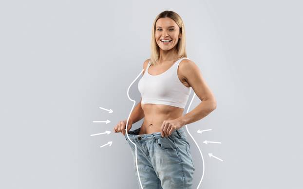 Cheery,Attractive,Slender,Middle,Aged,Blonde,Woman,Wearing,Huge,Jeans,