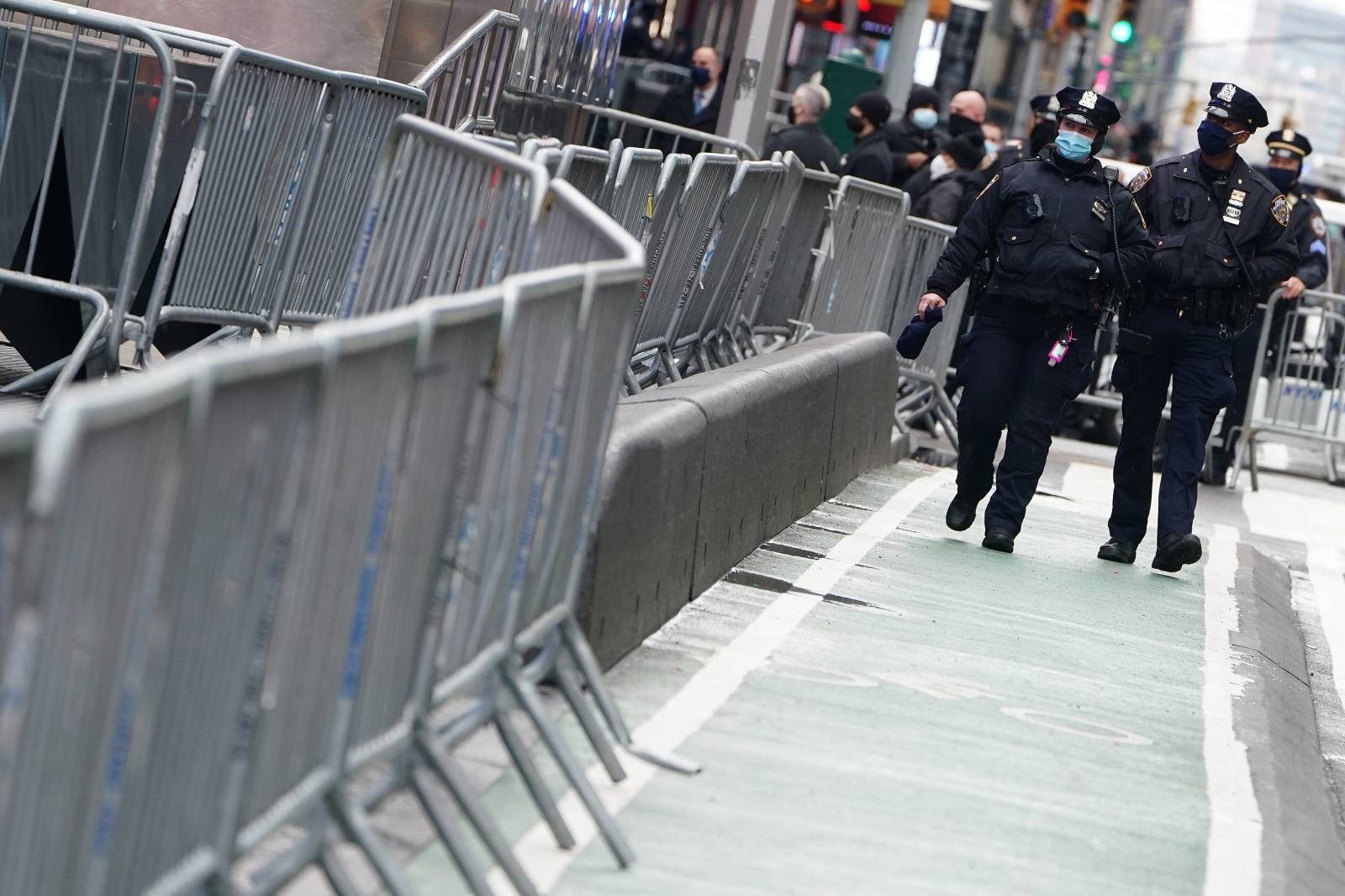 Police walk checkpoints to prevent people from entering Times Square ahead of New Year's Eve