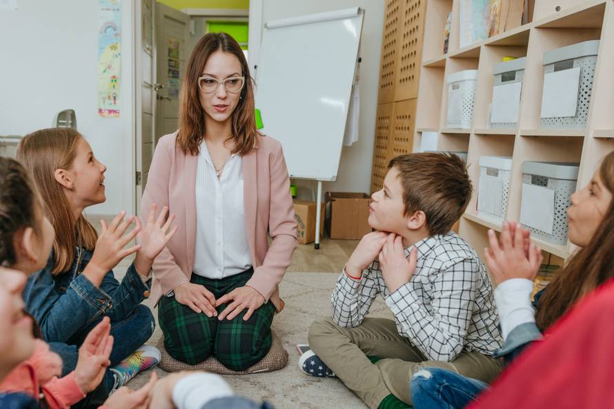 Elementary,School,Students,Talking,In,The,Classroom