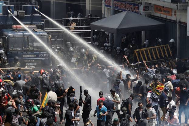 Police uses tear gas and water cannons to disperse demonstrators near President's residence, in Colombo