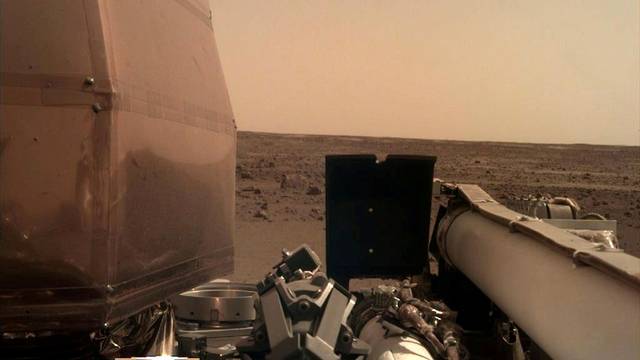 FILE PHOTO: The Instrument Deployment Camera's image of the Martian surface the day the spacecraft touched down on the Red Planet