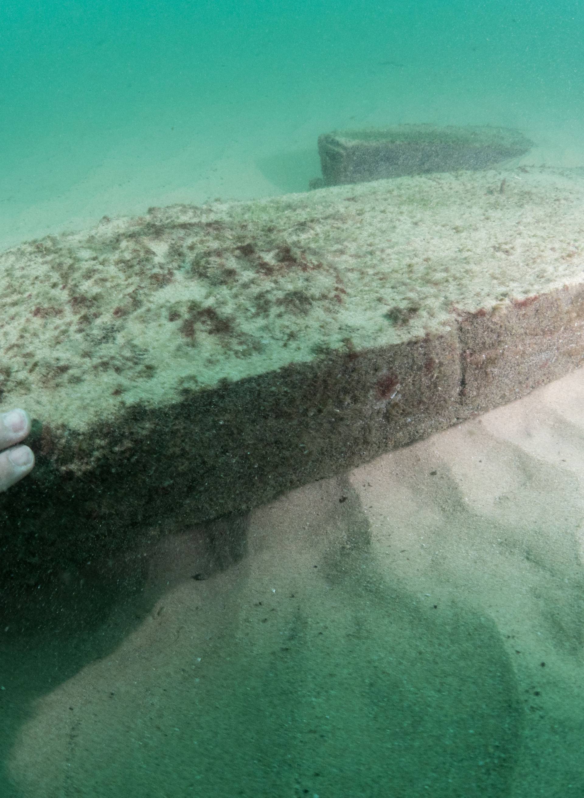 Divers are seen during the discovery of a centuries-old shipwreck, in Cascais