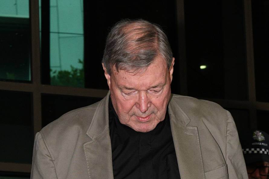 Cardinal George Pell departs the Melbourne Magistrates Court in Melbourne