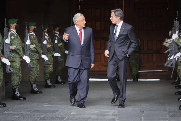 Mexican President Andres Manuel Lopez Obrador speaks with U.S. Secretary of State Anthony Blinken after his arrival at the National Palace to attend a meeting with Mexico and U.S. delegations, in Mexico City