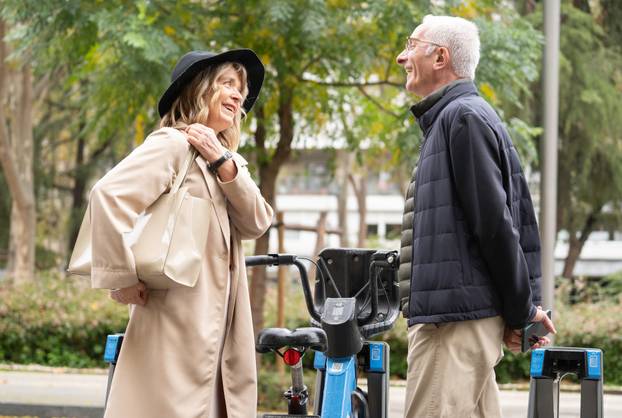 Senior couple sharing a happy conversation in park