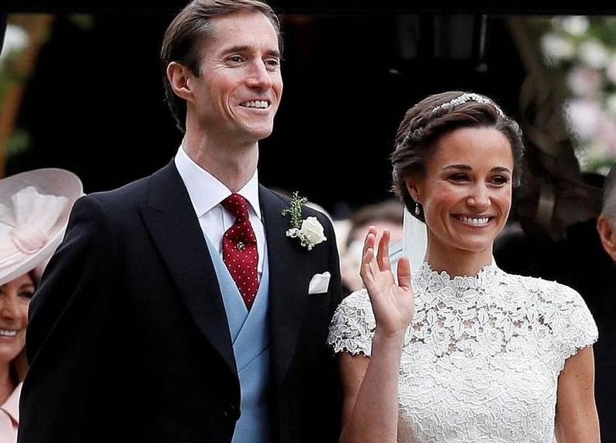 FILE PHOTO: Pippa Middleton and James Matthews pose for photographs after their wedding at St Mark's Church in Englefield