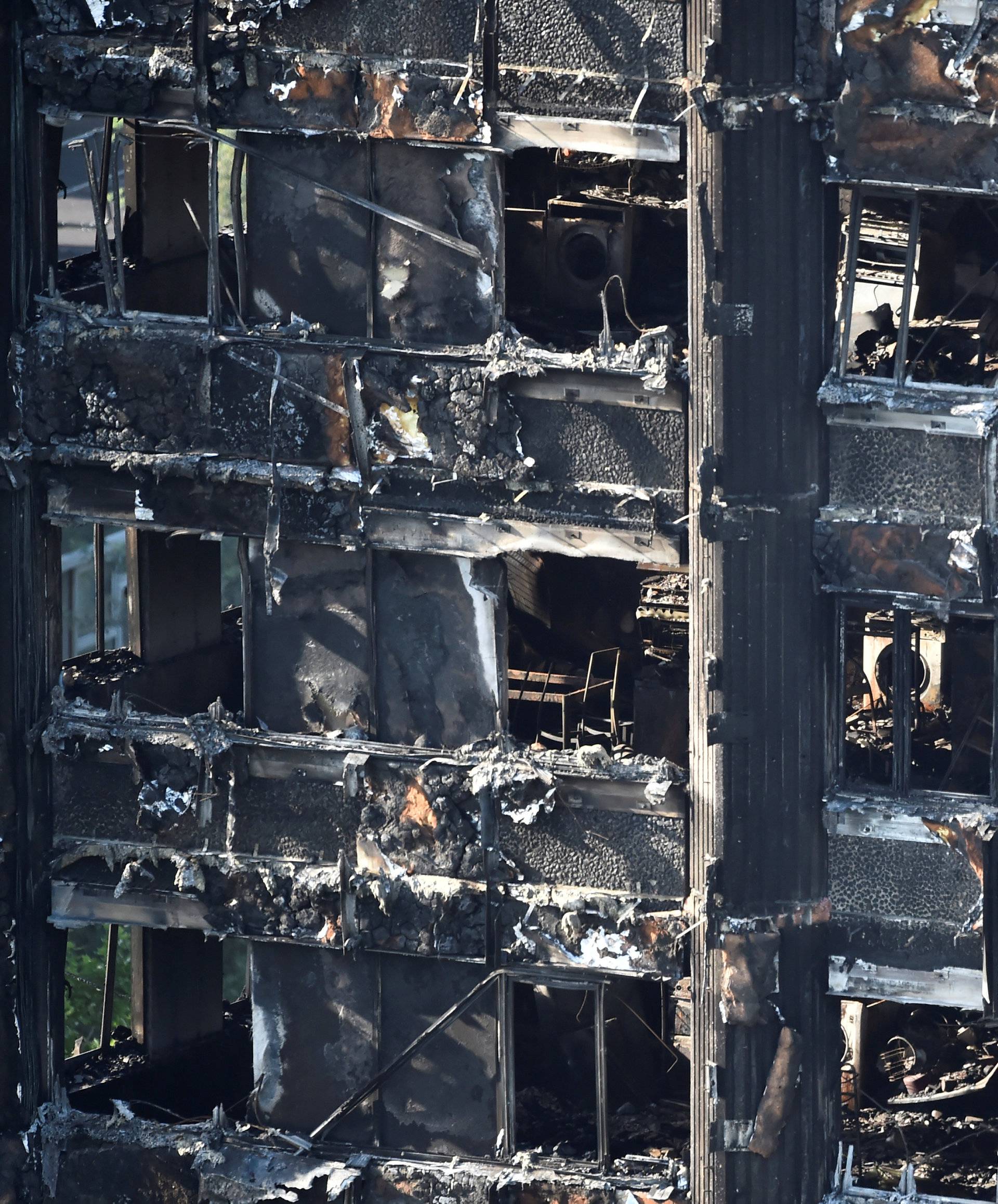 Extensive damage is seen to the Grenfell Tower block which was destroyed in a disastrous fire, in north Kensington, West London