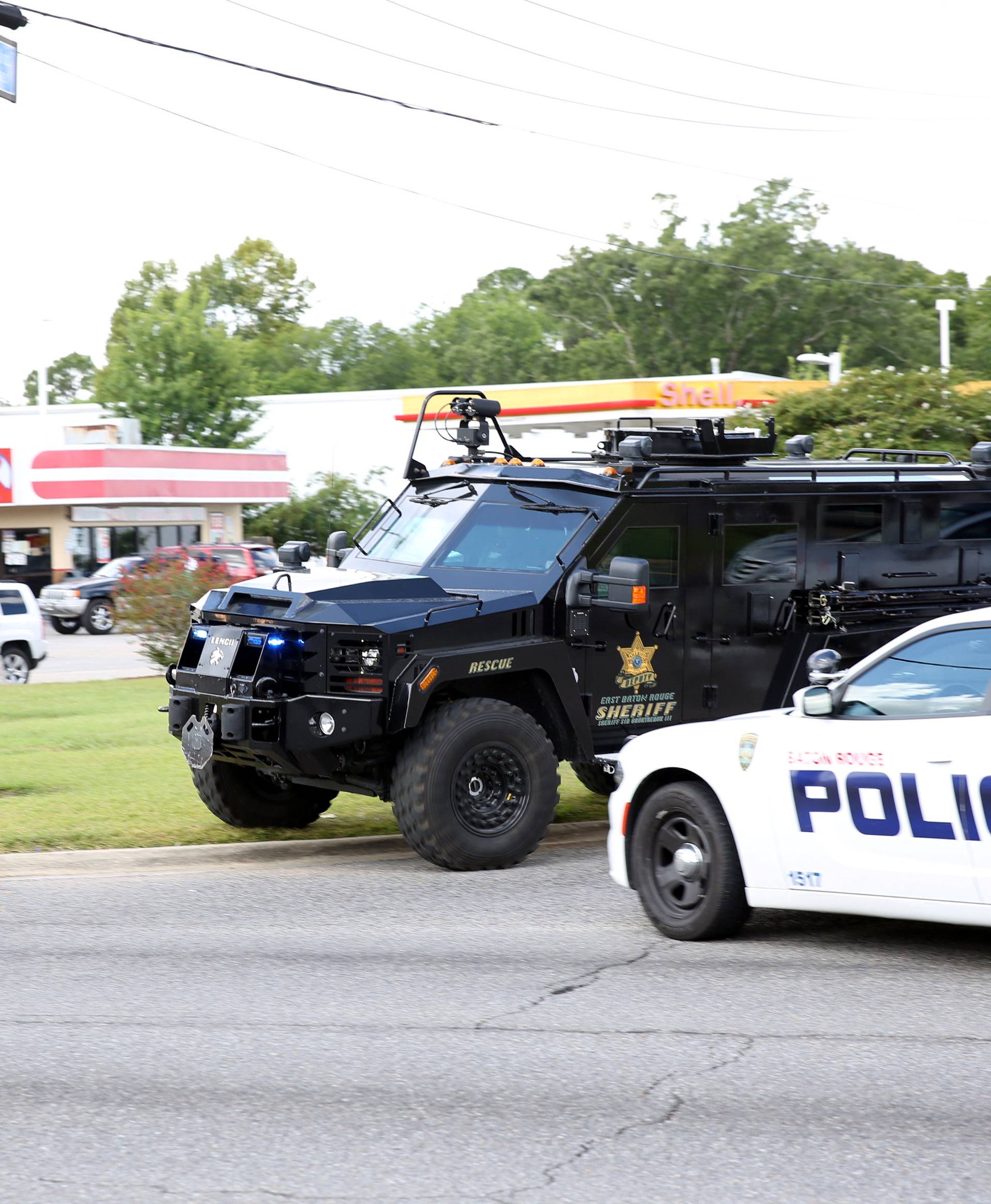 Police officers block off a road after a shooting of police in Baton Rouge