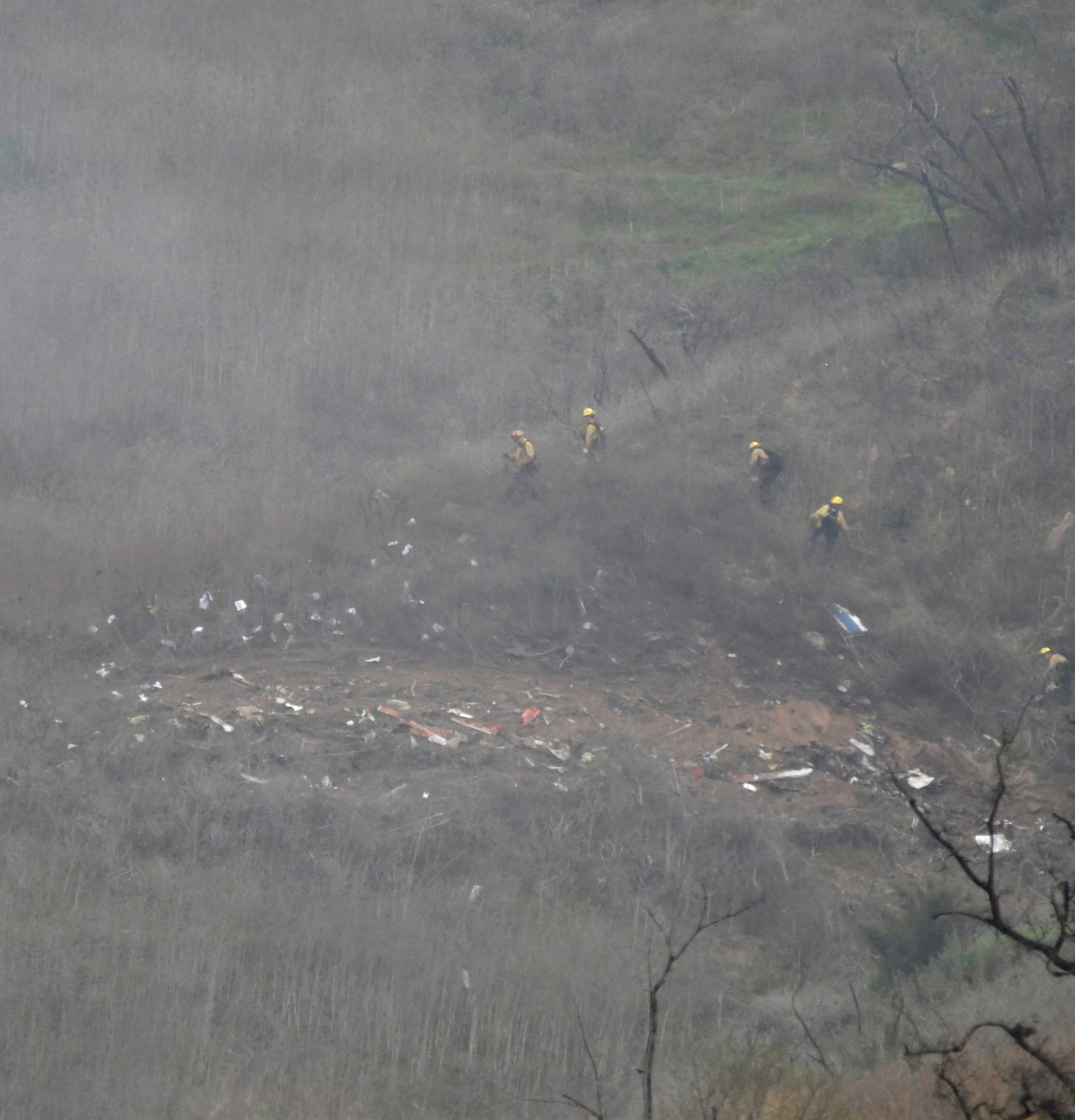 LA county firefighters on the scene of a helicopter crash that reportedly killed Kobe Bryant in Calabasas