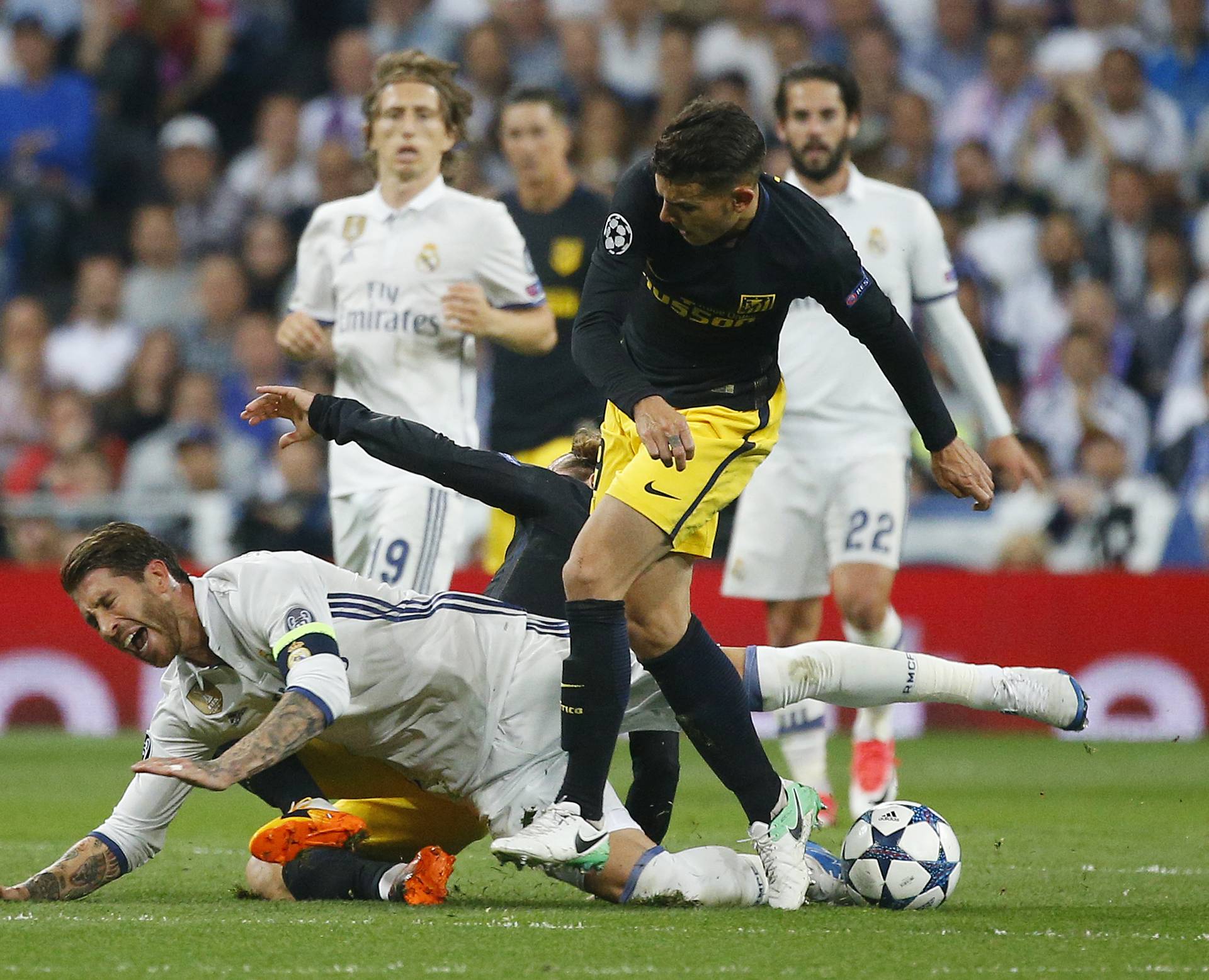 Real Madrid's Sergio Ramos in action with Atletico Madrid's Lucas Hernandez