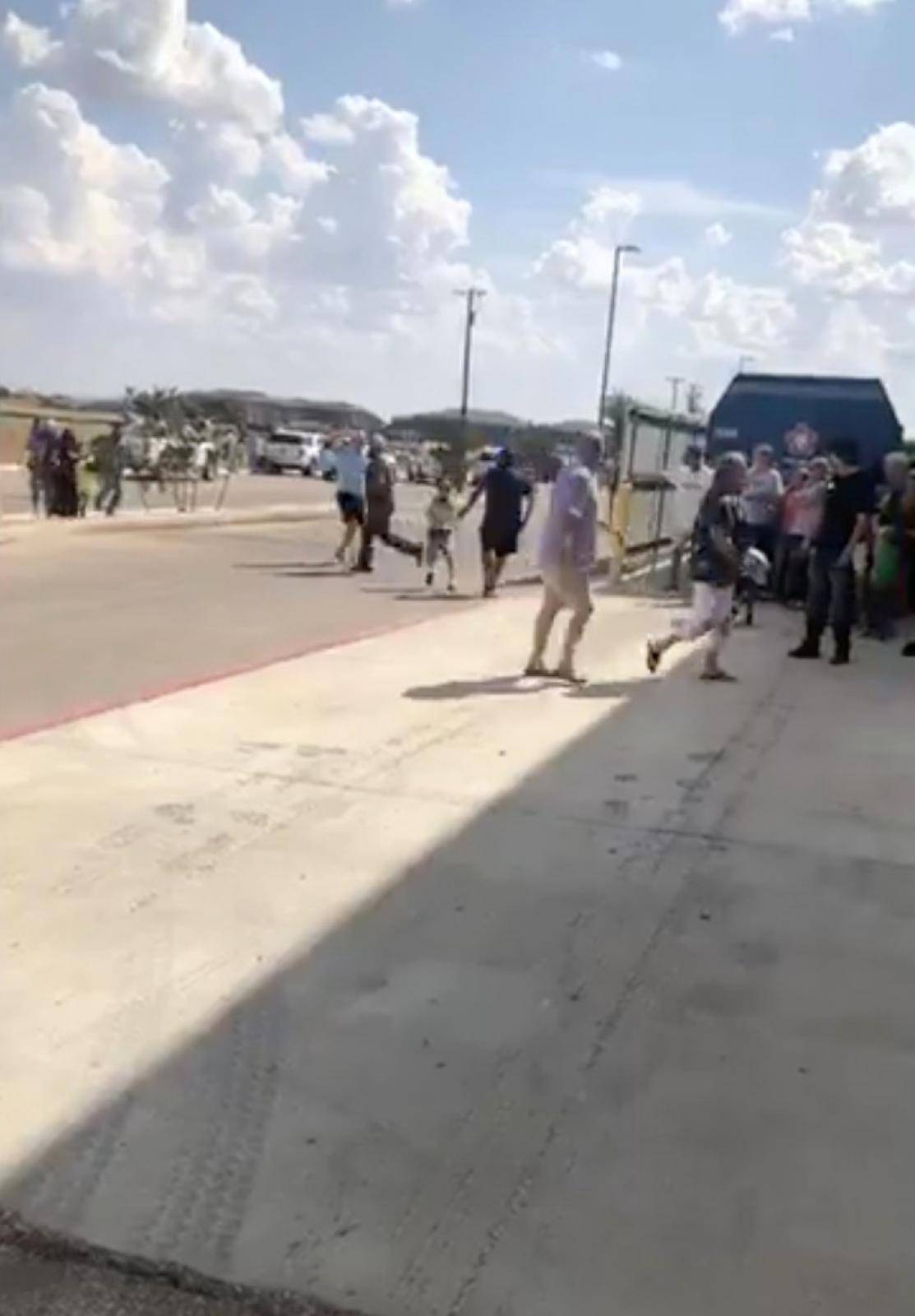 People are evacuated from Cinergy Odessa cinema following a shooting in Odessa, Texas