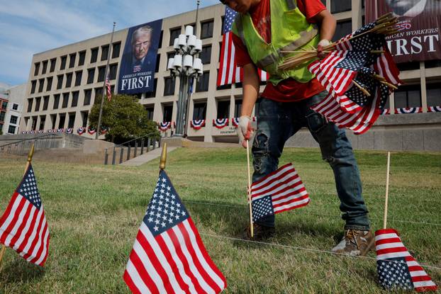 A banner picturing President Trump hangs on the Department of Labor building in Washington