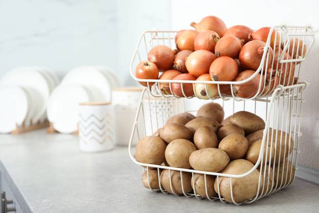 Container,With,Potatoes,And,Onions,On,Grey,Kitchen,Counter,,Space