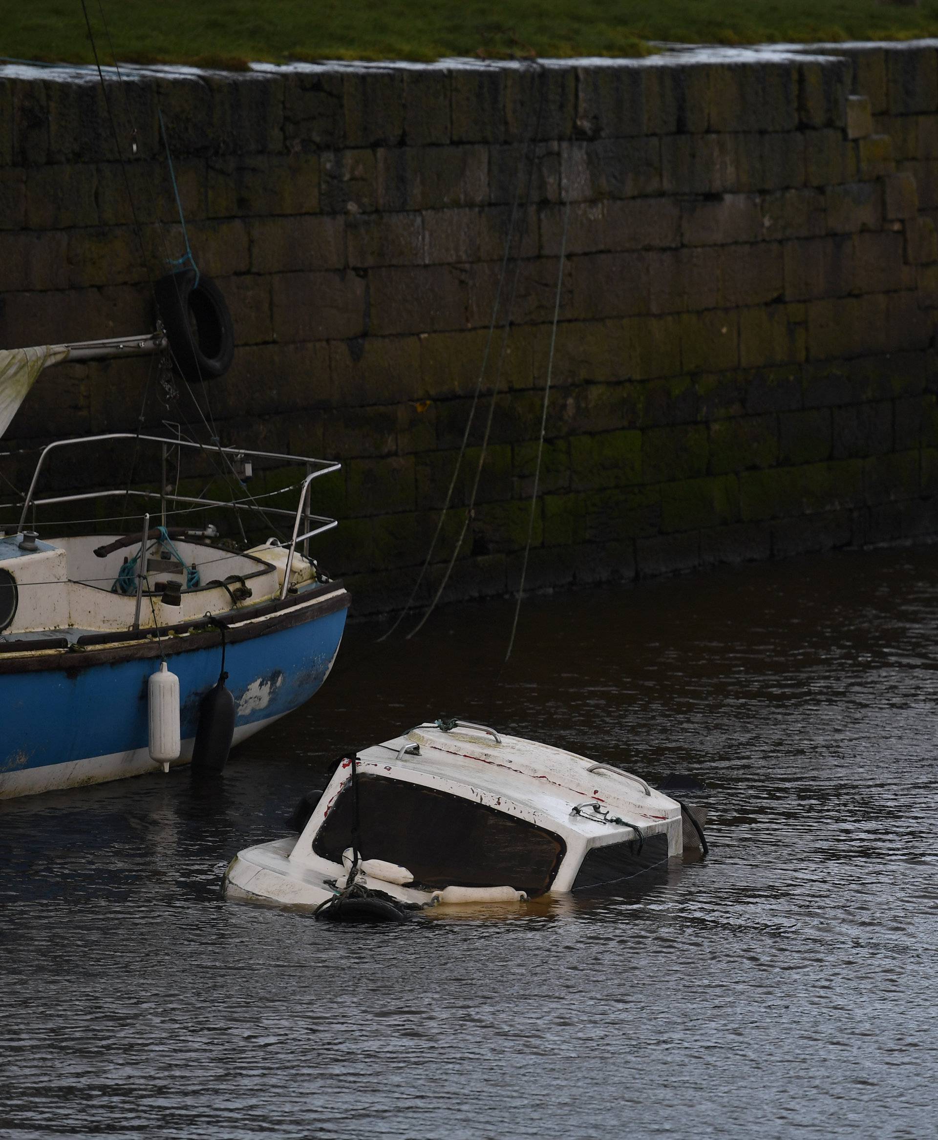 A sunken boat is seen half submerged after Storm Eleanor in Galway Bay