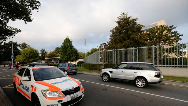 A Geneve police car is pictured near a Greenpeace demonstration against the trade agreements TTIP, CETA and TiSA in front of the U.S. Mission in Geneva