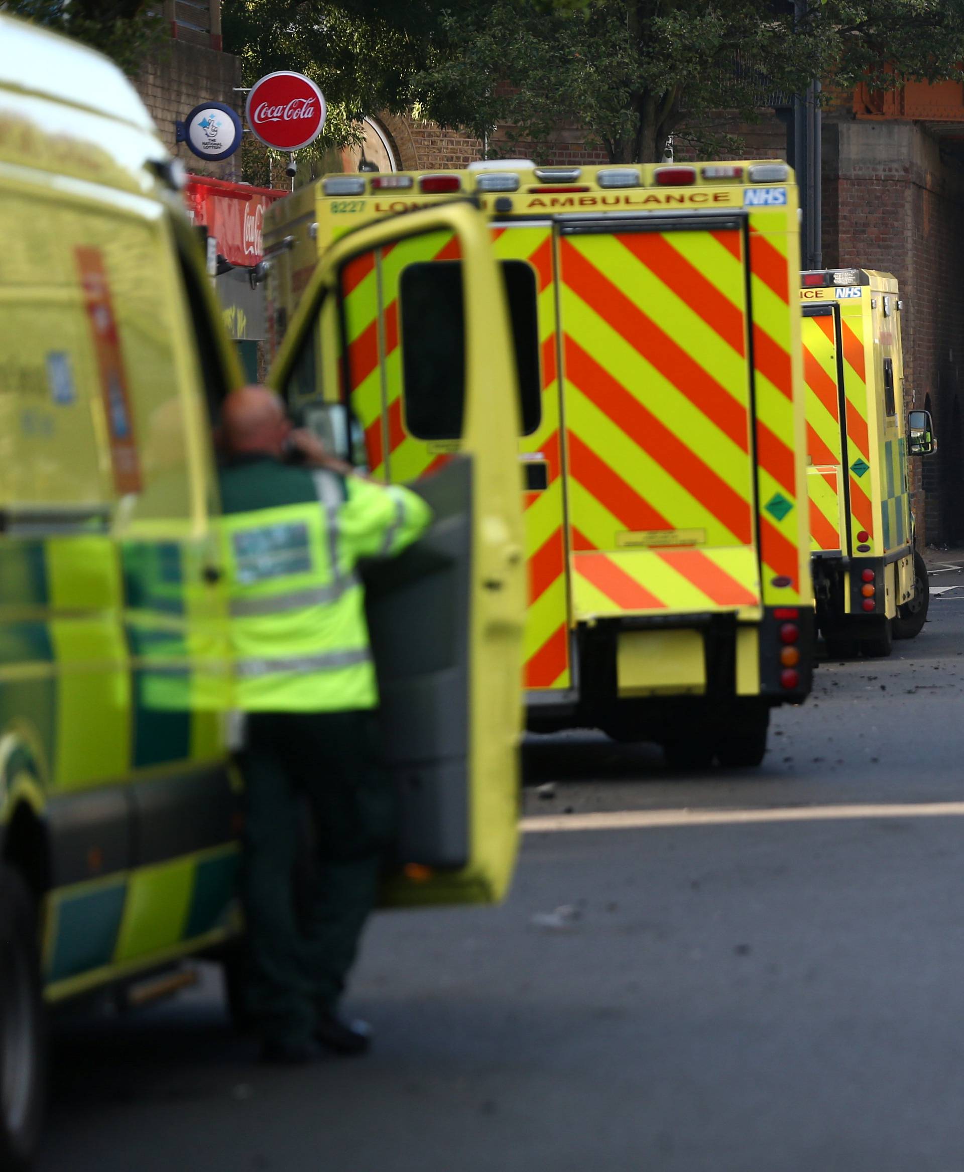 Ambulances gather near to the scene of a serious fire in a tower block at Latimer Road in West London
