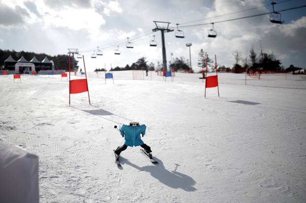 Robot Tae Kwon V skies during the Ski Robot Challenge at a ski resort in Hoenseong