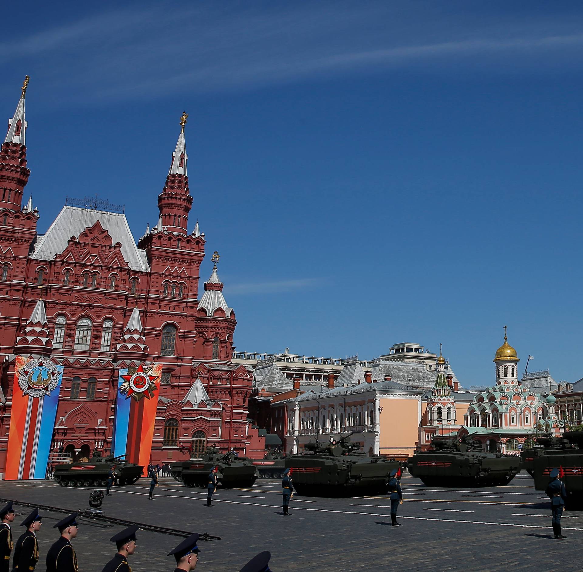 Russian servicemen drive military vehicles during the Victory Day parade at Red Square in Moscow