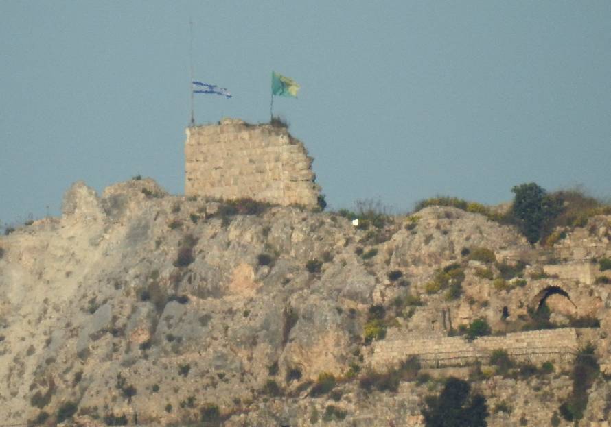 An Israeli flag and a flag of the Golani Brigade are raised on Beaufort Castle, as seen from Marjayoun