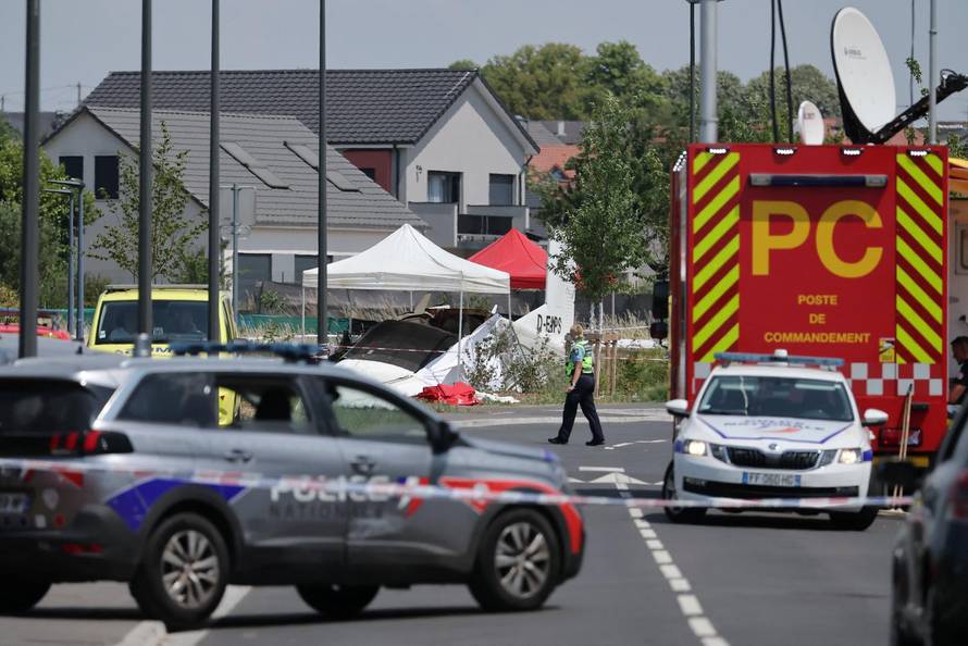 French rescuers work at the site of a plane crash, in Tomblaine