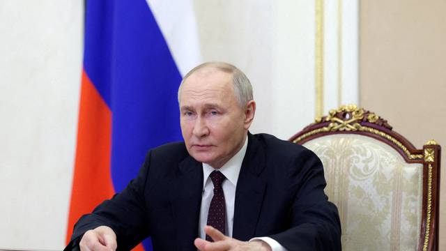 FILE PHOTO: Russian President Putin chairs a meeting on economic issues via video link in Moscow