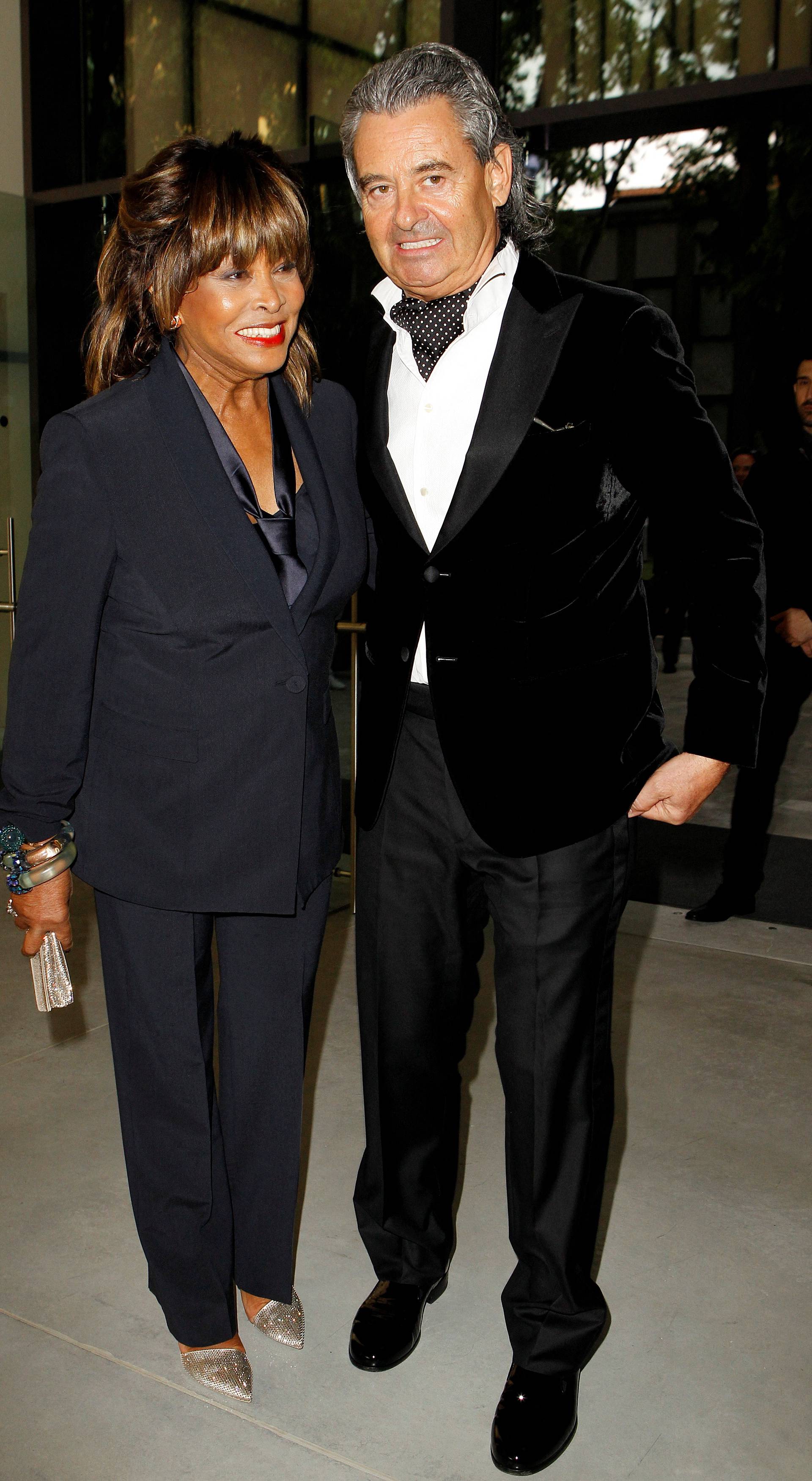 FILE PHOTO: Tina Turner pose with husband Erwin Bach before Giorgio Armani's fashion show to celebrate 40th anniversary of career and to mark opening of the Expo 2015 in Milan
