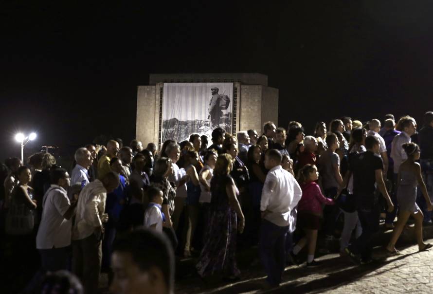 People wait in line to pay tribute to Cuba's late President Fidel Castro at the Jose Marti Memorial in Revolution Square in Havana
