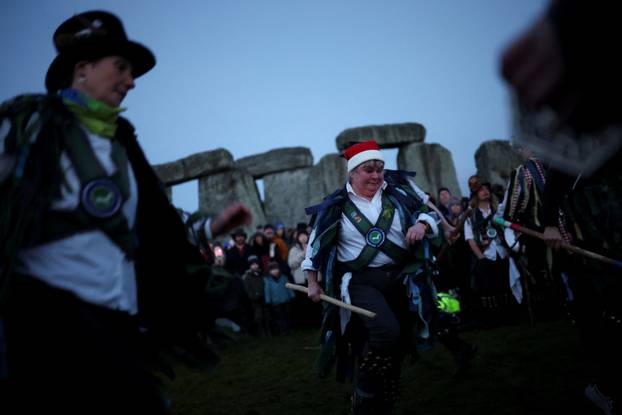 Winter solstice celebrations during sunrise at Stonehenge