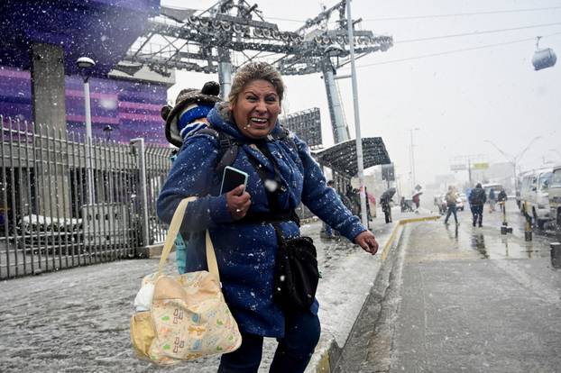 Snow falls amid low temperatures in Bolivia, in El Alto
