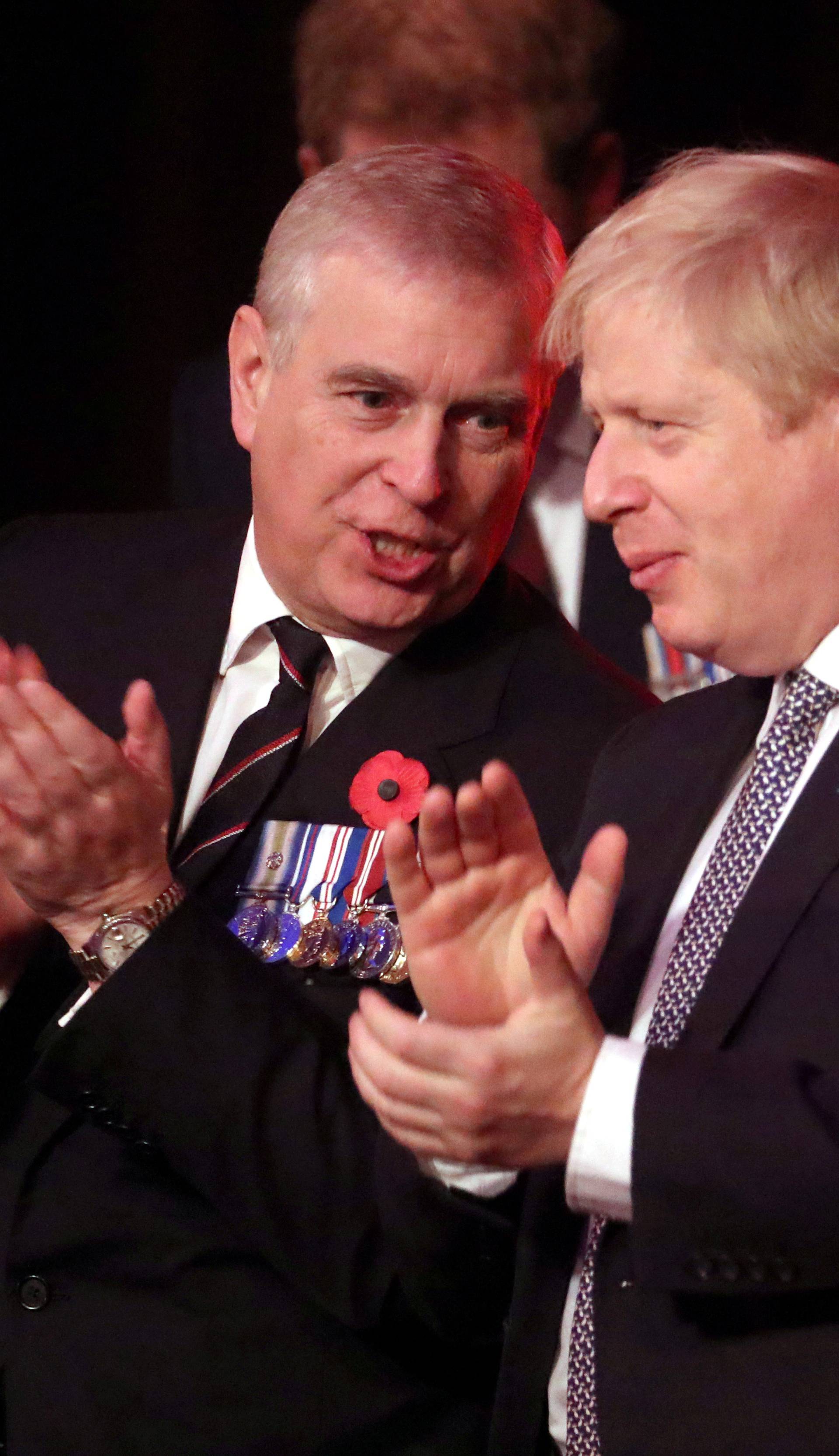 FILE PHOTO: Britain's Prince Andrew and Prime Minister, Boris Johnson, attend the Festival of Remembrance in London