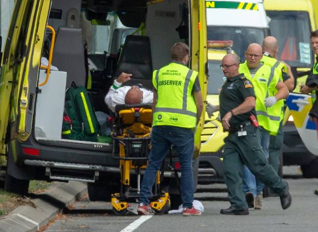 An injured person is loaded into an ambulance following a shooting at the Al Noor mosque in Christchurch