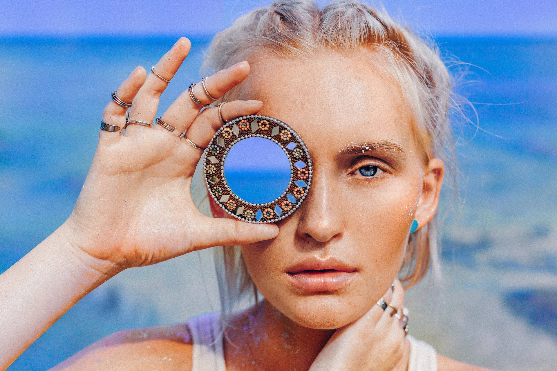 beautiful young fashion model on the beach. Close up portrait of