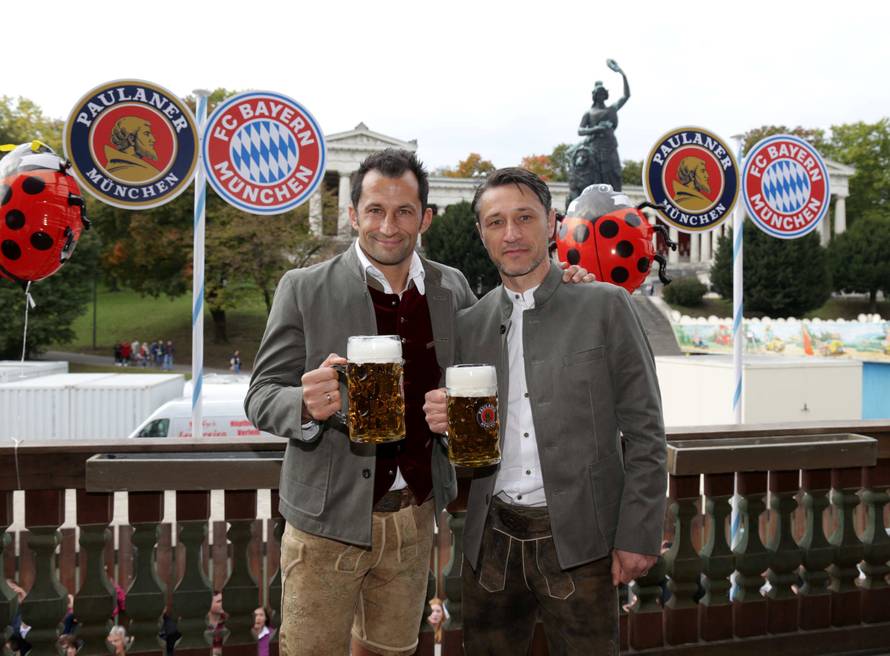 FC Bayern Munich's coach Niko Kovac and sporting director Hasan Salihamidzic pose during a visit at the Oktoberfest in Munich