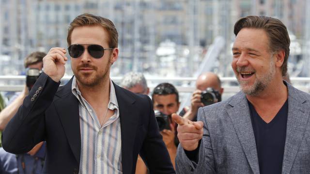 Cast members Russell Crowe and Ryan Gosling pose during a photocall for the film "The Nice Guys" out of competition at the 69th Cannes Film Festival in Cannes