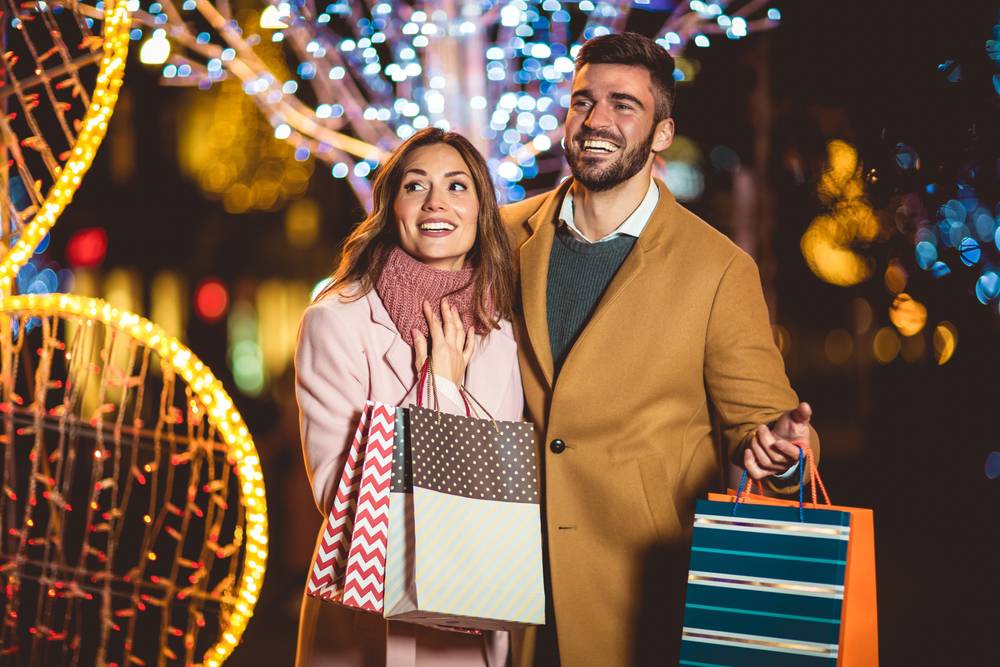 Young,Romantic,Couple,Holding,Shopping,Bag,Having,Fun,Outdoors,In