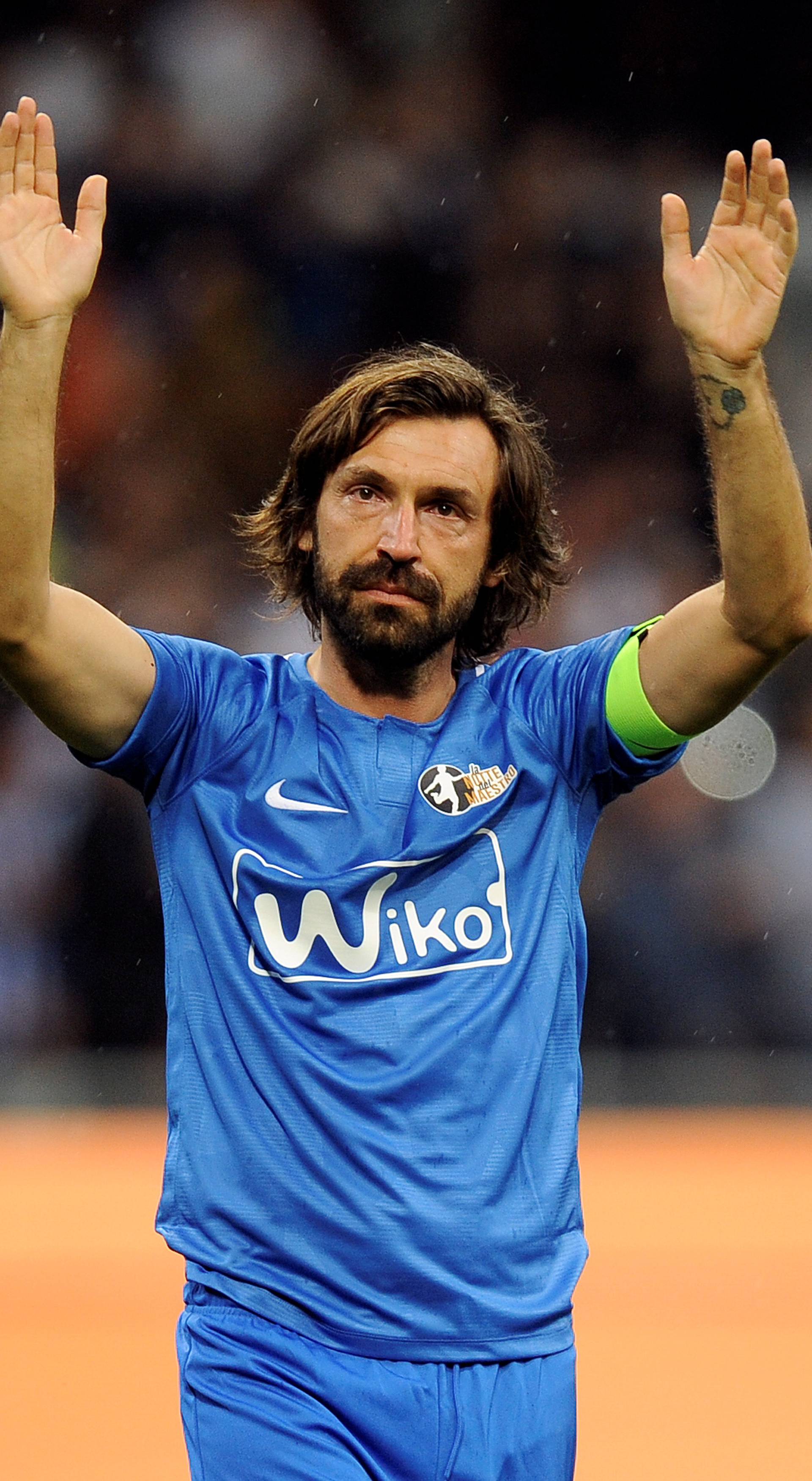Former Italian soccer player Andrea Pirlo waves at the end of his farewell soccer match at the San Siro stadium in Milan