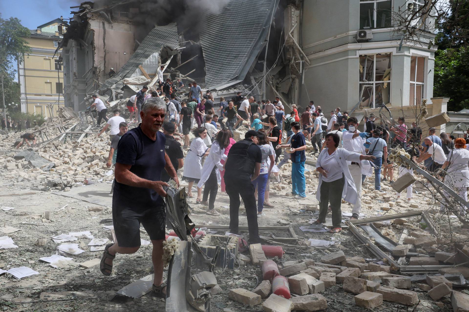 Rescuers work at Ohmatdyt Children's Hospital that was damaged during Russian missile strikes, in Kyiv